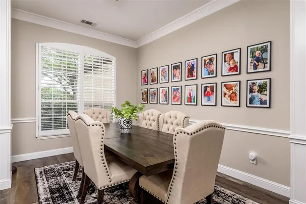a living room with furniture and a mirror