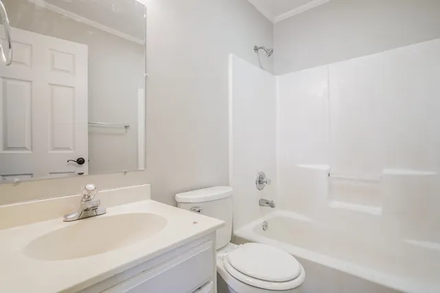 a bathroom with a sink toilet and bathtub