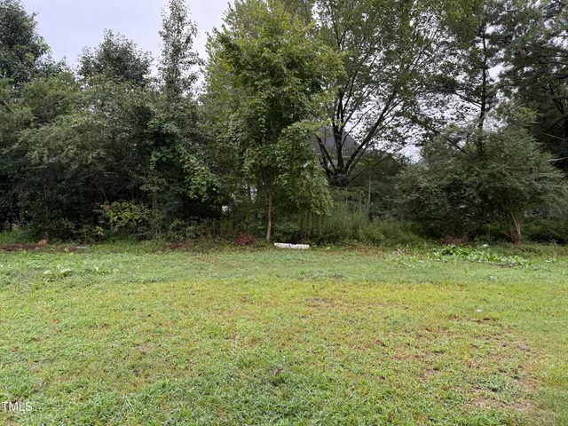 a car parked in the middle of a field
