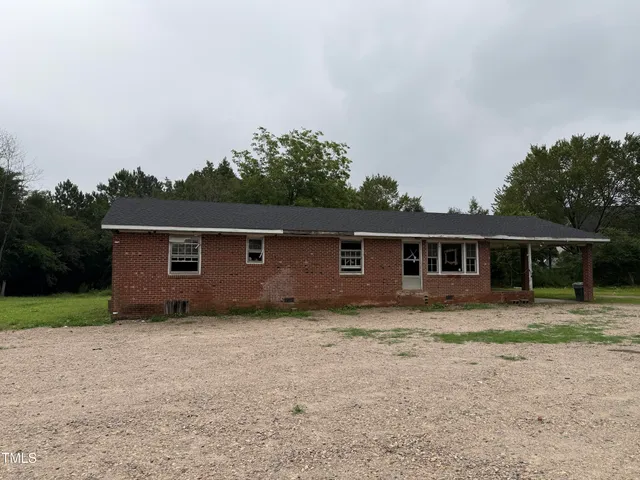 a view of a room with gym equipment and floor to ceiling window