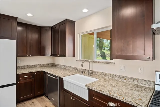 a kitchen with a sink and a refrigerator