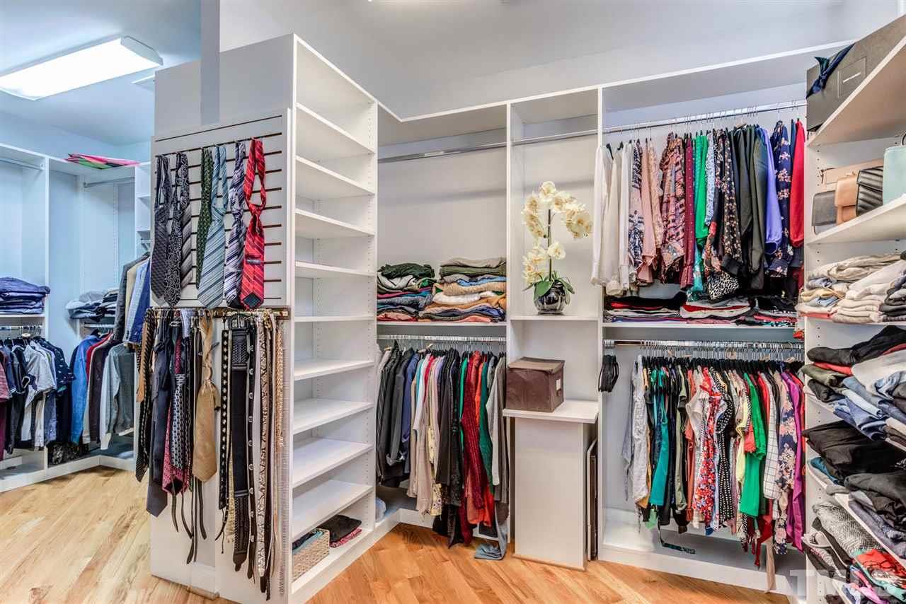 12249 Beestone Lane Raleigh, NC 27614 - Photo 17 of 29 a view of walk in closet with clothes