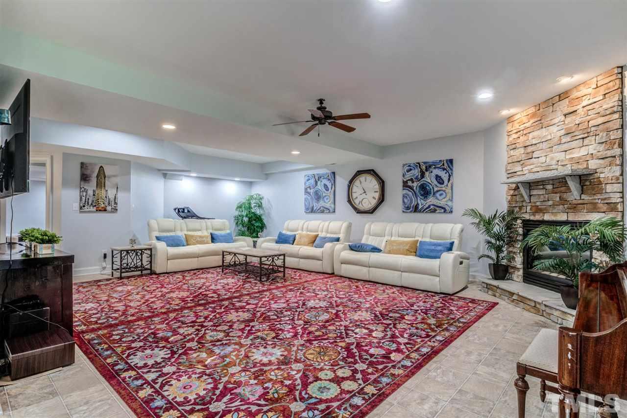 12249 Beestone Lane Raleigh, NC 27614 - Photo 10 of 29 a living room with furniture and a rug