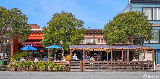 a view of a building with sitting area