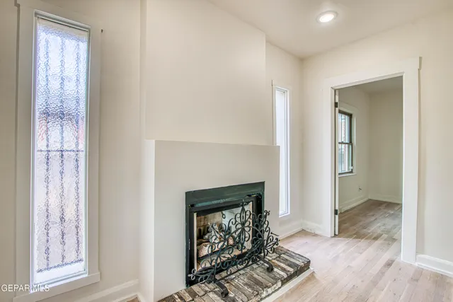 a stove top oven sitting inside of a kitchen