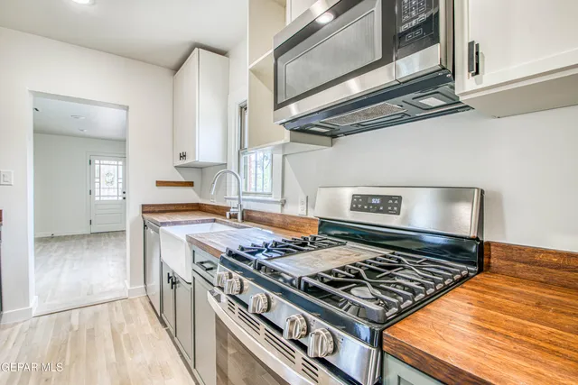 a view of a kitchen cabinets and wooden floor