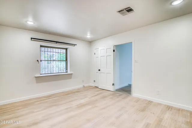a view of an empty room and entryway