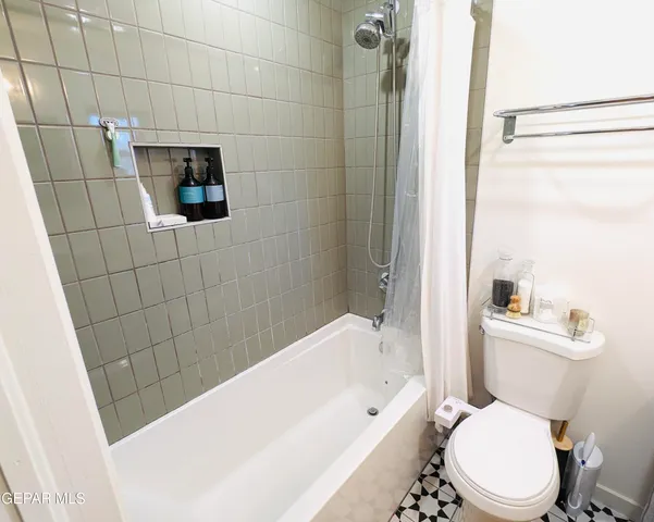 a front view of a building with traffic signal lights