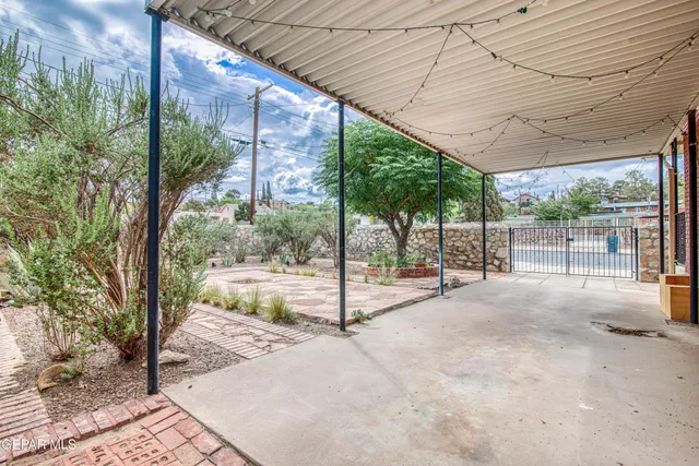 an aerial view of a house with garden space and street view