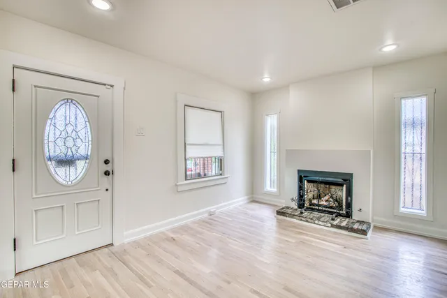 a kitchen with stainless steel appliances granite countertop a refrigerator and a stove