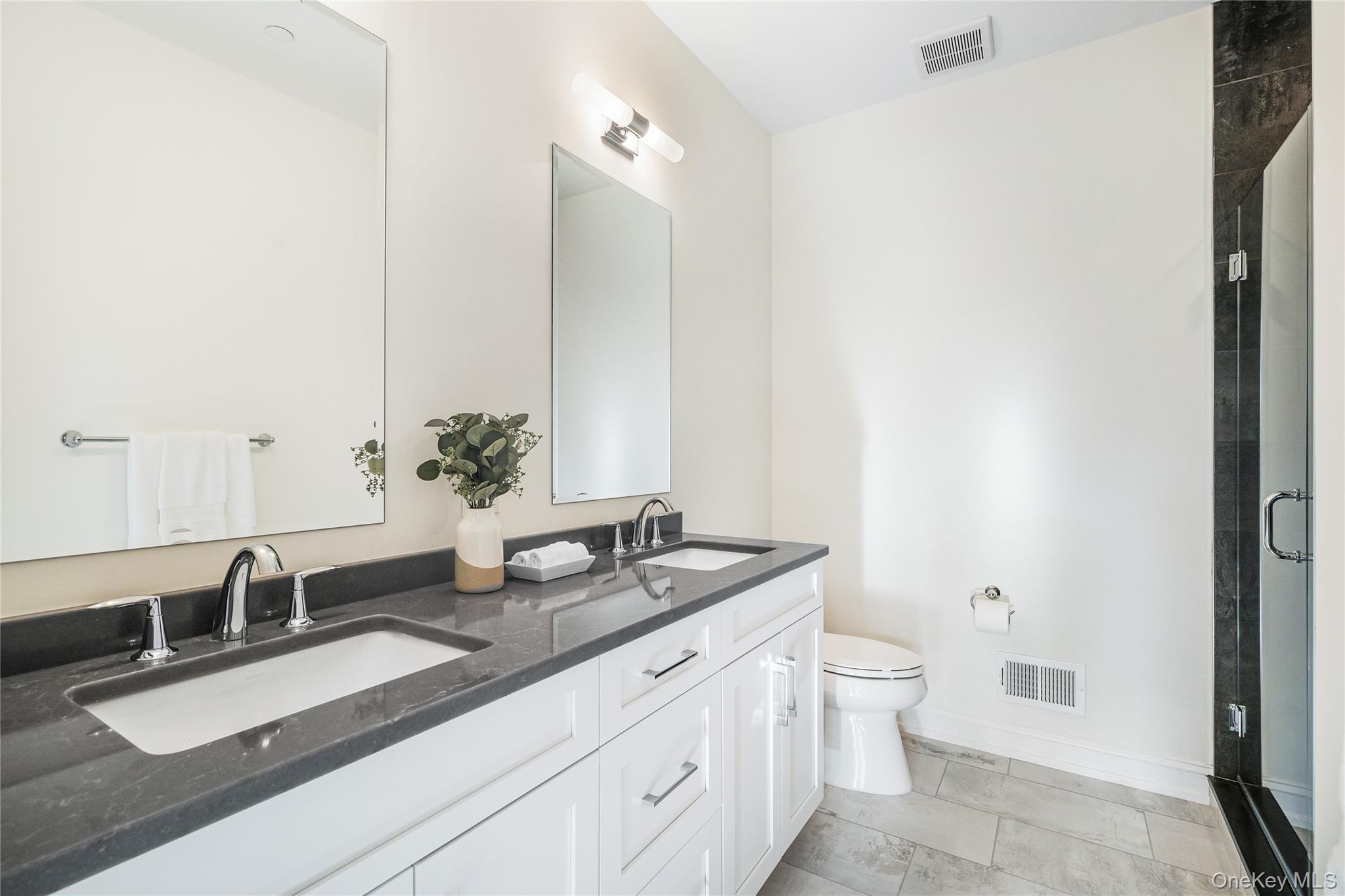 2040 Crompond Road, Unit 6 Yorktown Heights, NY 10598 - Photo 13 of 22 Bathroom with vanity, a shower with door, and toilet