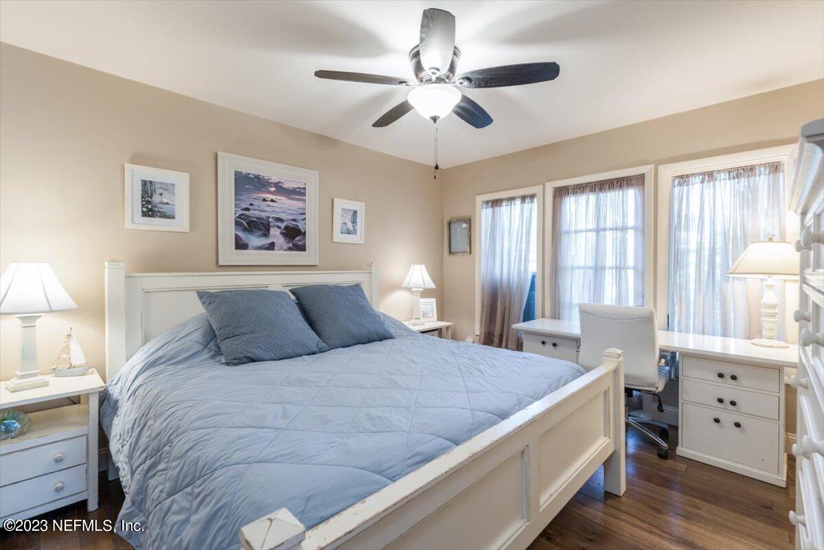 75 Fishermans Cove Road Ponte Vedra Beach, FL 32082 - Photo 16 of 47 a bedroom with a large bed and a chandelier