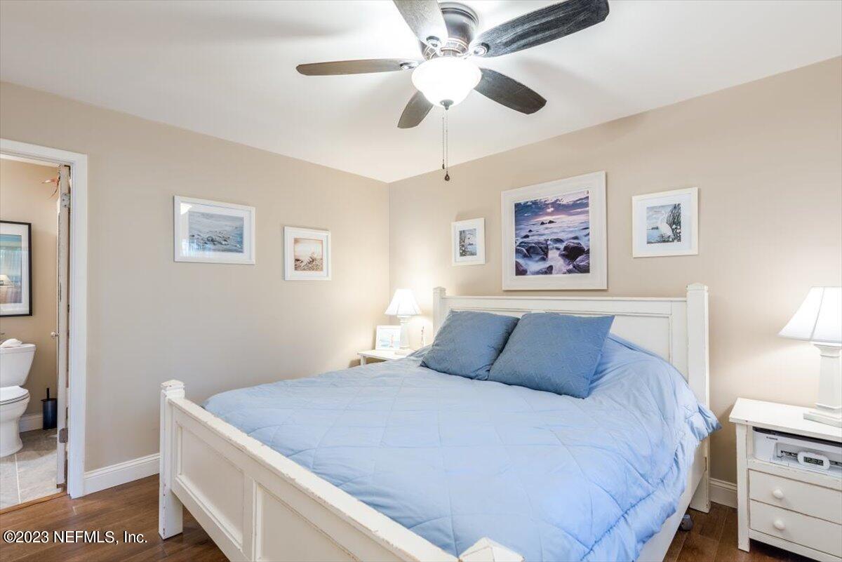 75 Fishermans Cove Road Ponte Vedra Beach, FL 32082 - Photo 17 of 47 a bedroom with a large bed and a chandelier