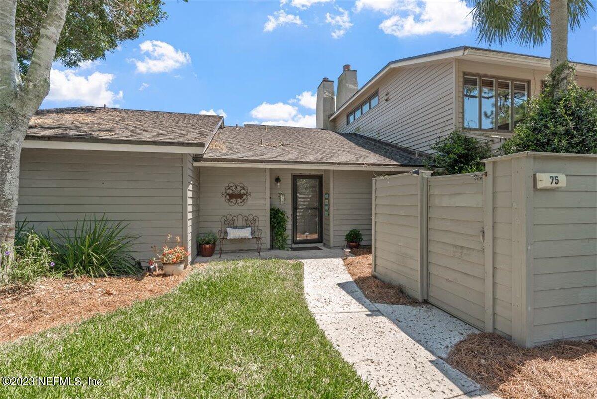 75 Fishermans Cove Road Ponte Vedra Beach, FL 32082 - Photo 3 of 47 a front view of a house with a yard