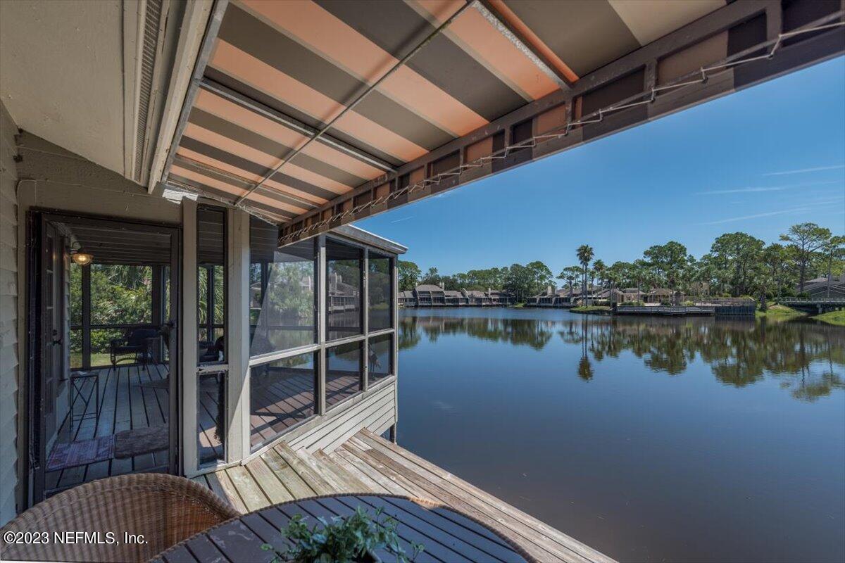 75 Fishermans Cove Road Ponte Vedra Beach, FL 32082 - Photo 34 of 47 a view of a balcony with chair and floor to ceiling window