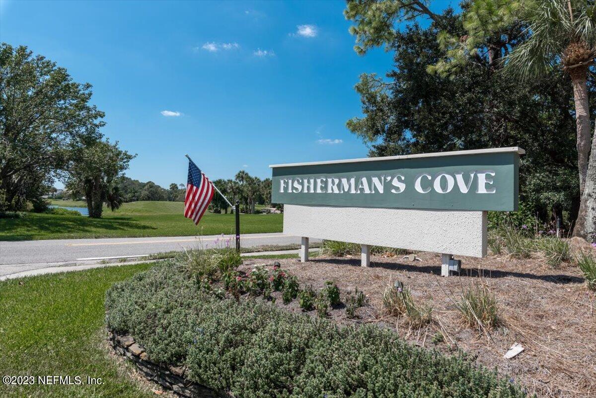 75 Fishermans Cove Road Ponte Vedra Beach, FL 32082 - Photo 45 of 47 a sign of golf club on a wall under a tree