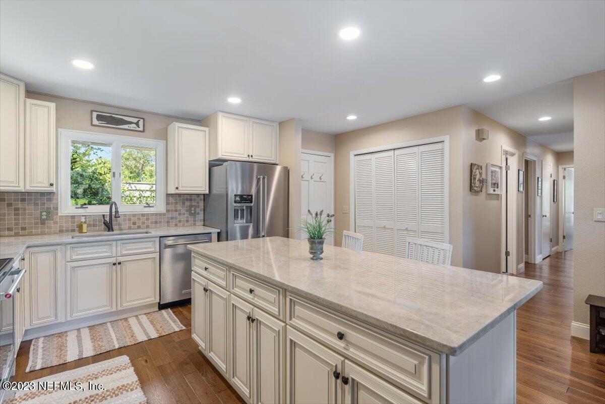 75 Fishermans Cove Road Ponte Vedra Beach, FL 32082 - Photo 6 of 47 a kitchen with stainless steel appliances granite countertop a sink refrigerator and cabinets