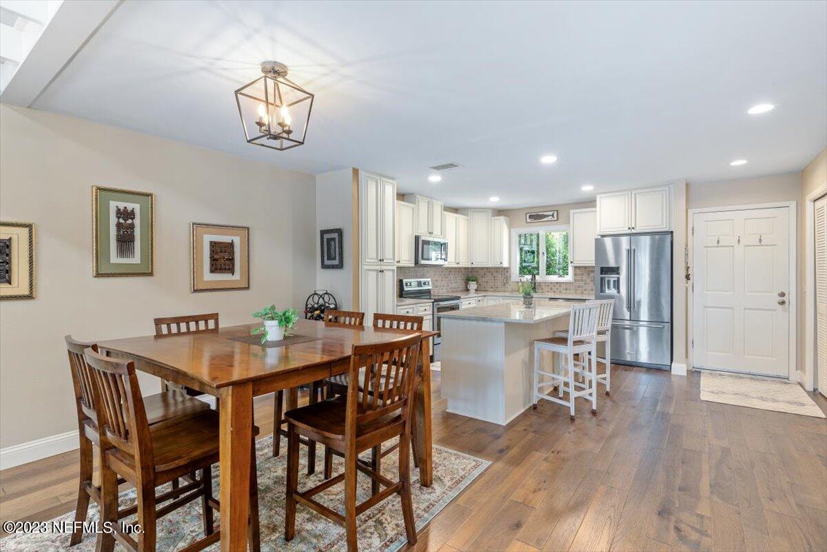 75 Fishermans Cove Road Ponte Vedra Beach, FL 32082 - Photo 10 of 47 a view of a dining room with furniture and wooden floor
