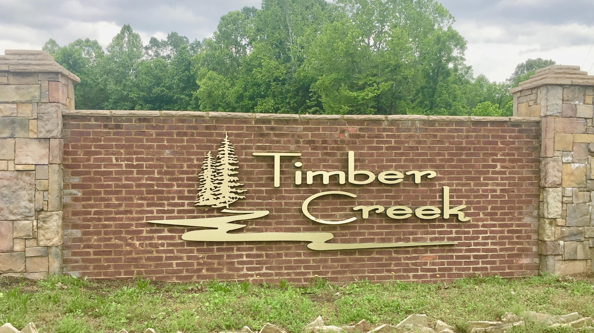 300 Timber Creek Road Maynardville, TN 37807 - Photo 17 of 17 a sign that is on a brick wall