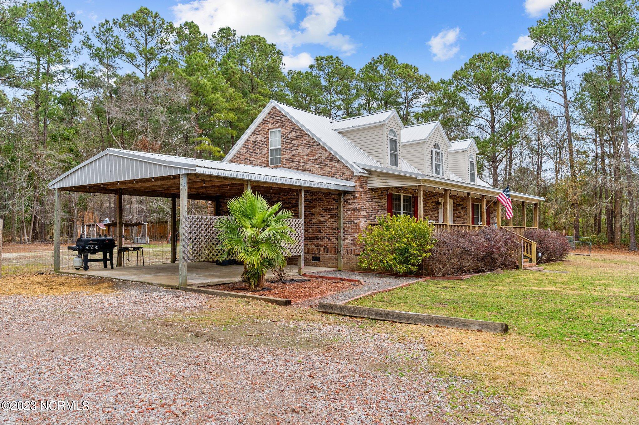 1272 Cherrytree Road Northeast Winnabow, NC 28479 - Photo 2 of 20 Double covered car port