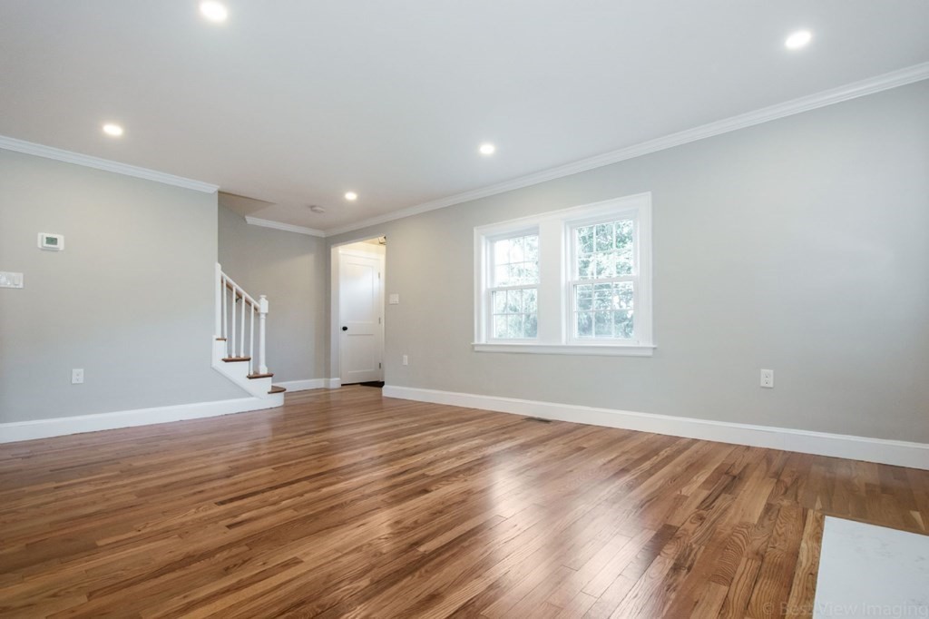 214 Riverside Drive Dedham, MA 02026 - Photo 11 of 26 an empty room with wooden floor and windows