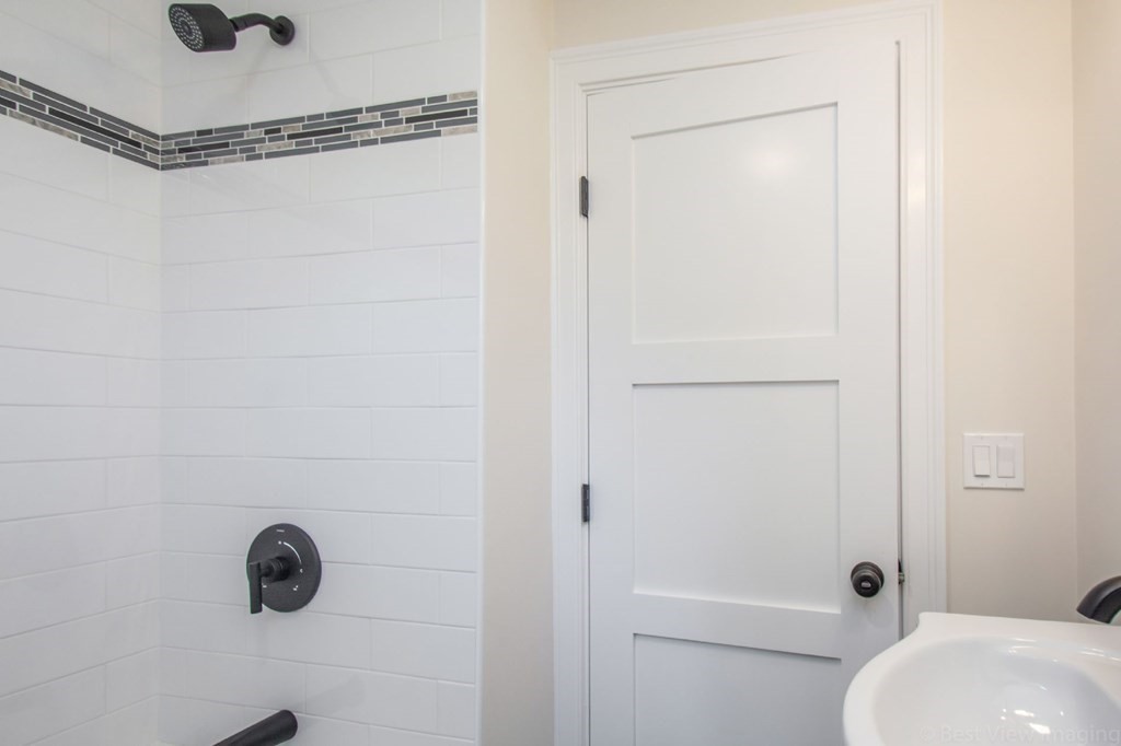 214 Riverside Drive Dedham, MA 02026 - Photo 14 of 26 a bathroom with a shower a toilet and a window