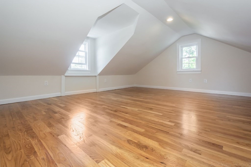 214 Riverside Drive Dedham, MA 02026 - Photo 17 of 26 an empty room with wooden floor and windows