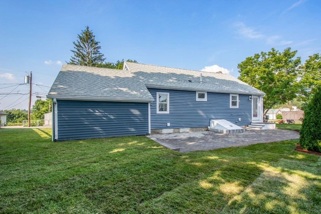 214 Riverside Drive Dedham, MA 02026 - Photo 26 of 26 a front view of a house with a yard