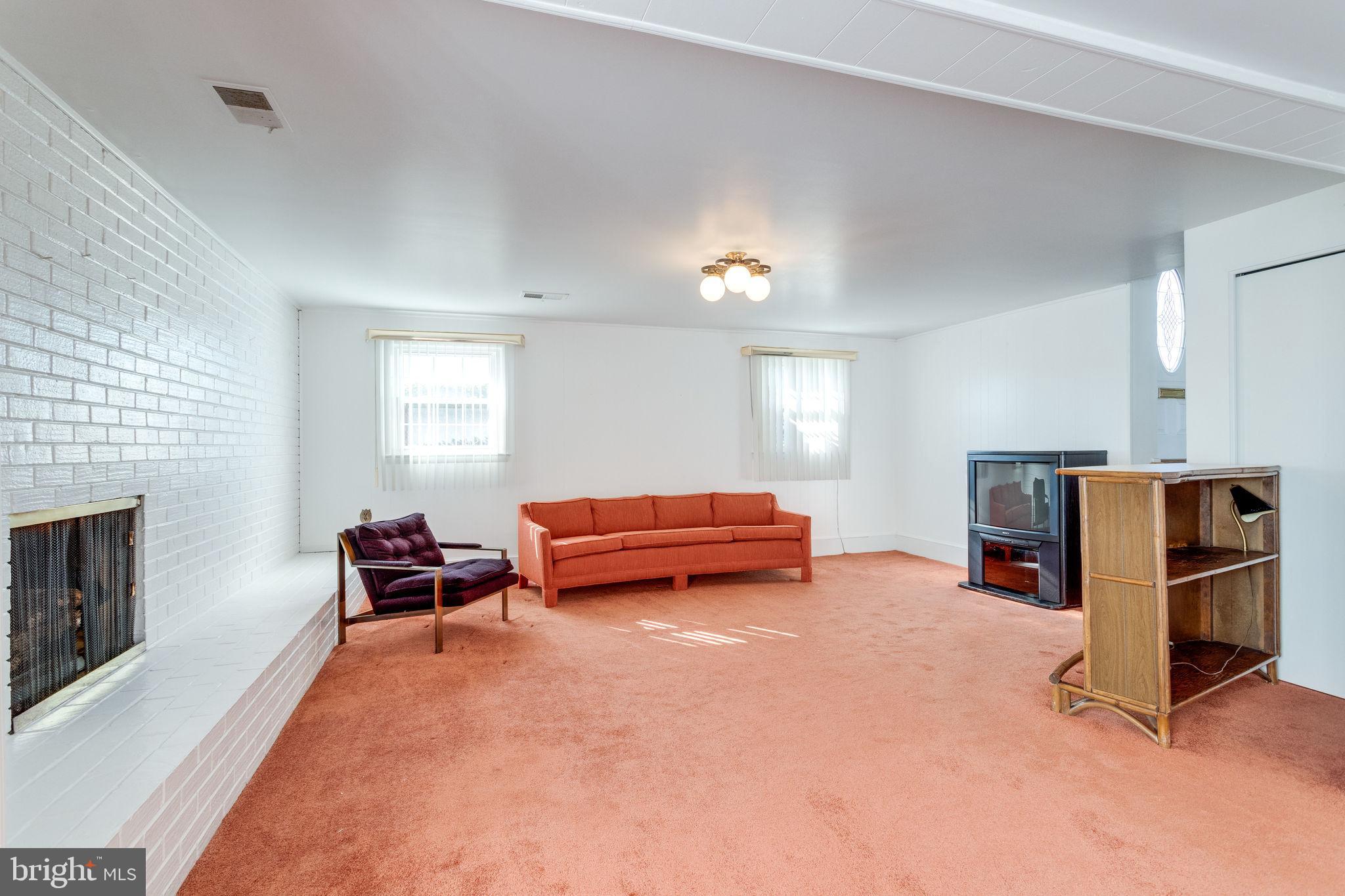 6424 Meriwether Lane Springfield, VA 22150 - Photo 25 of 39 Rec room has gar fireplace