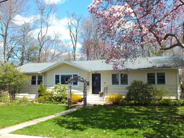 128 Lockwood Road Fairfield, CT 06825 - Photo 1 of 1 a front view of house with yard and green space