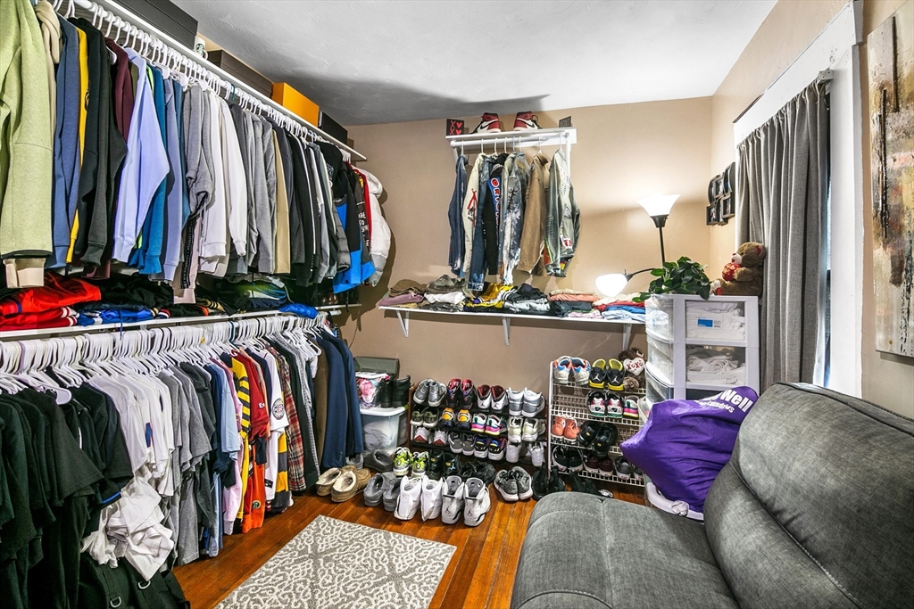 45-47 Bloomfield Street Springfield, MA 01108 - Photo 15 of 28 a view of walk in closet with clothes and shoes