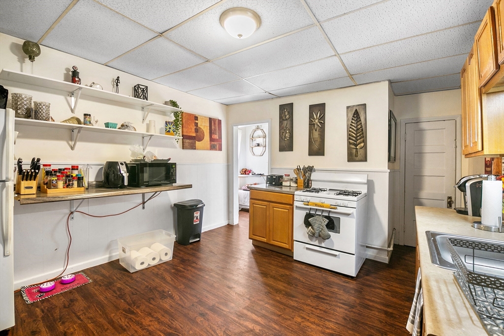 45-47 Bloomfield Street Springfield, MA 01108 - Photo 6 of 28 a kitchen with stainless steel appliances granite countertop a stove and cabinets