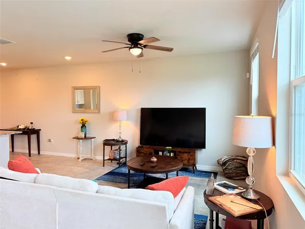 a living room with furniture and a window