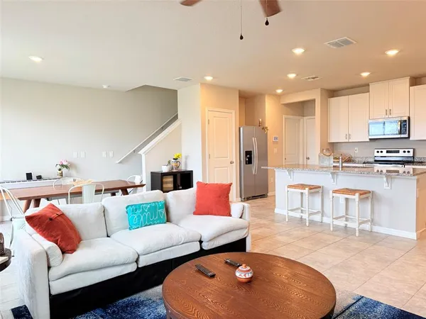 a view of a dining room with furniture and window