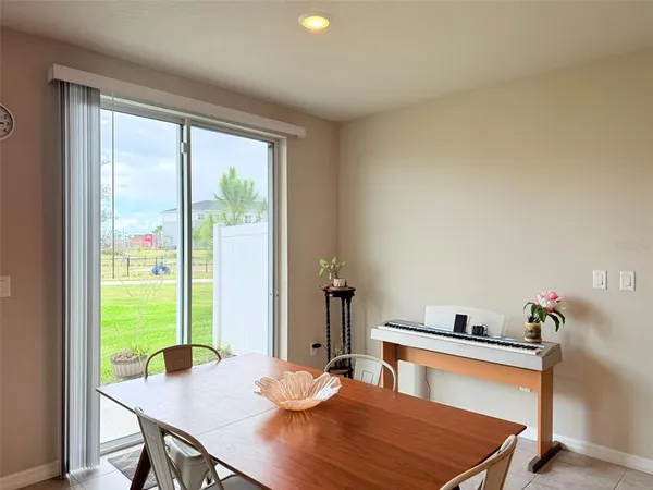 a kitchen with stainless steel appliances kitchen island granite countertop a sink a stove and a refrigerator