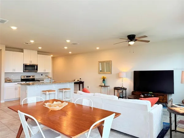 a bathroom with a sink mirror and toilet
