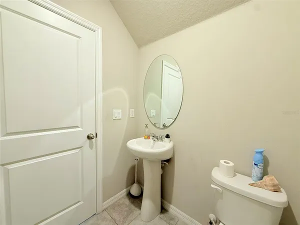 a view of a hallway with closet and wooden floor