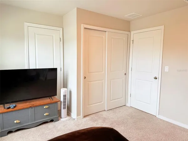 a bedroom with bed and window