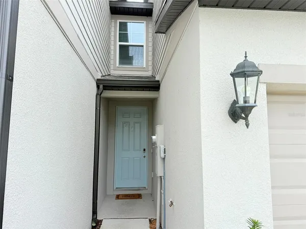 a bathroom with a granite countertop shower and a sink