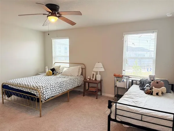 a white toilet sitting next to a small bathroom