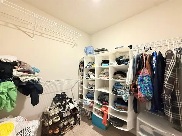 a swimming pool with outdoor seating and yard