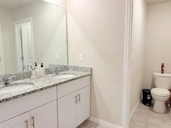 a view of a house with swimming pool and sitting area