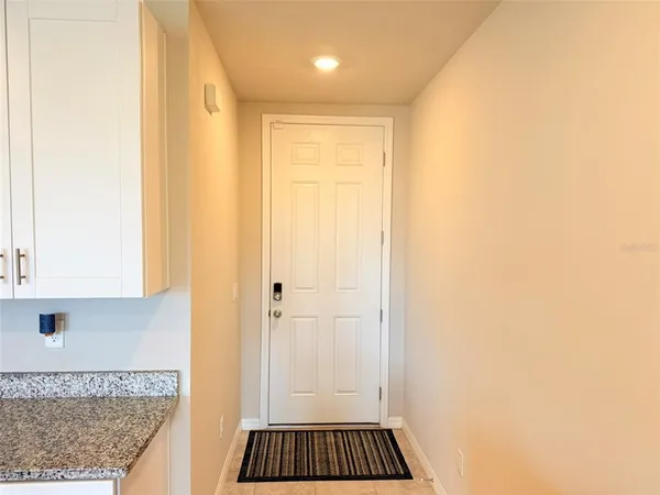 a kitchen with granite countertop a sink and a stove