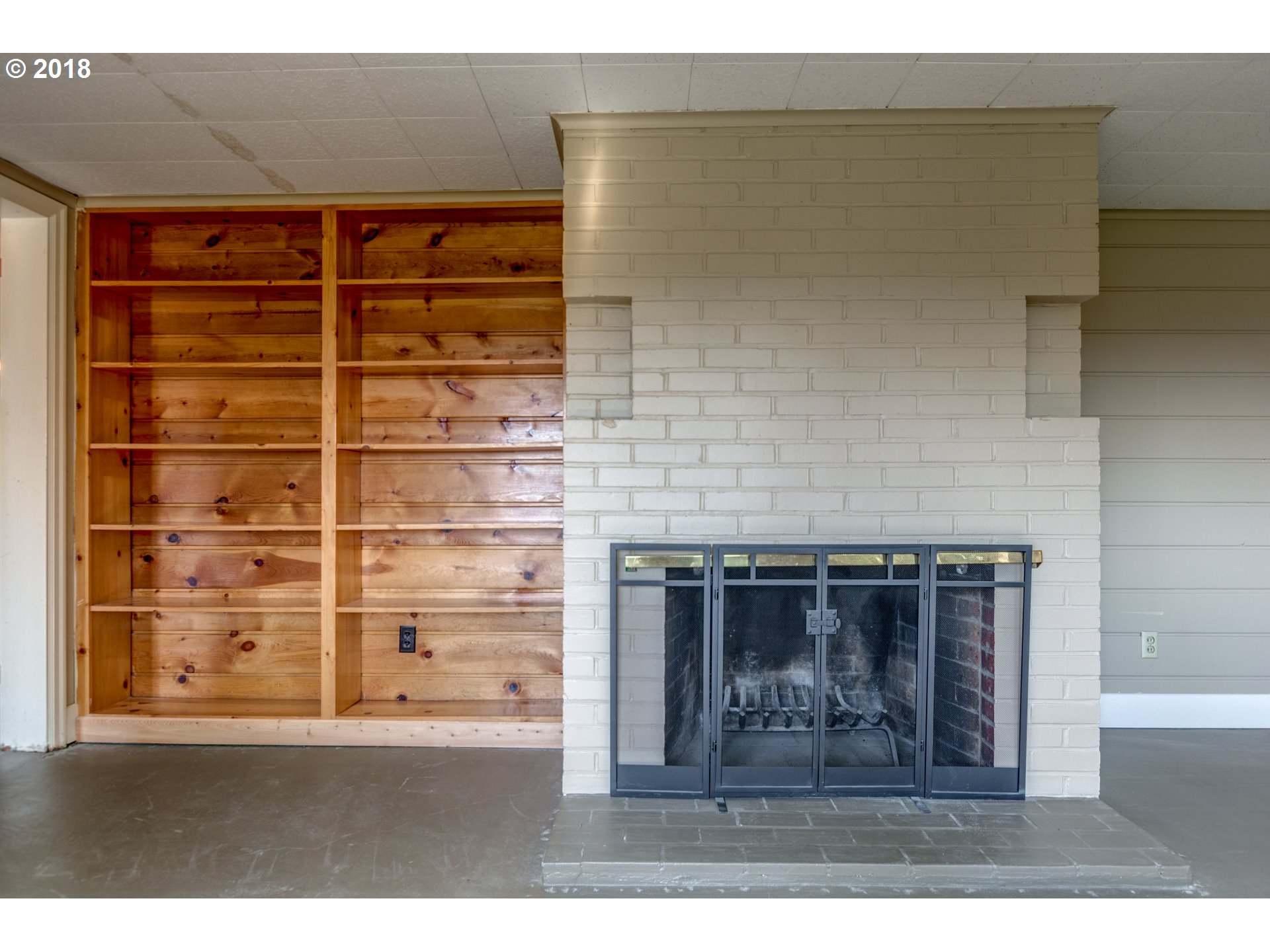 3925 Southwest Jerald Way Portland, OR 97221 - Photo 21 of 31 a black and white photo of a fireplace
