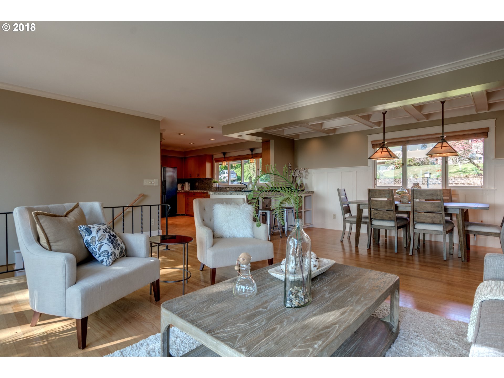 3925 Southwest Jerald Way Portland, OR 97221 - Photo 5 of 31 a living room with furniture a dining table and a large window