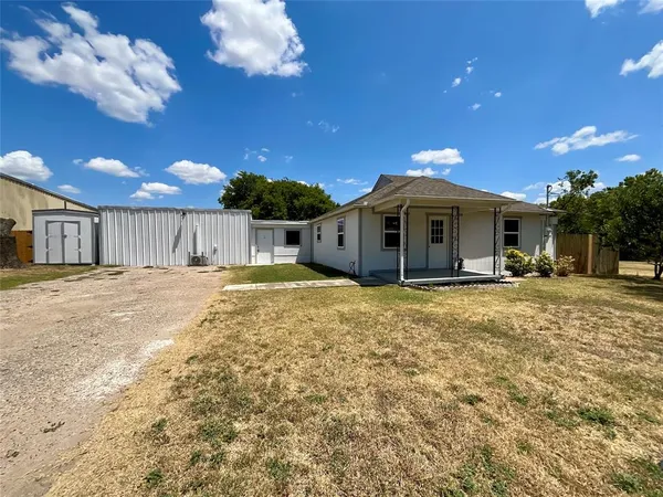 a view of a house with a yard porch and sitting area