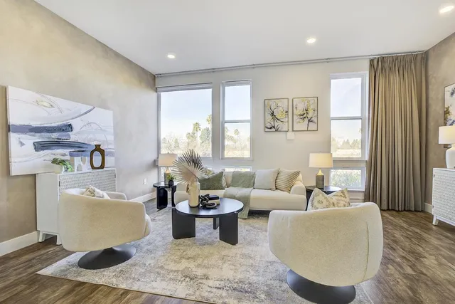 a living room with furniture and a window