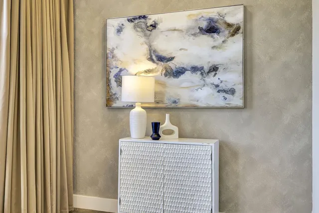 a view of bathroom with a sink and a mirror