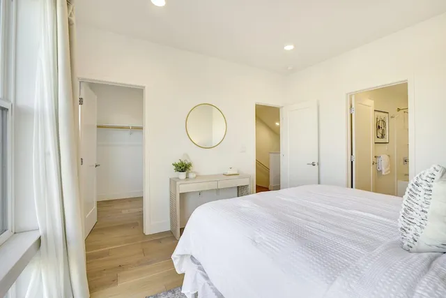 a bedroom with a bed and a dresser