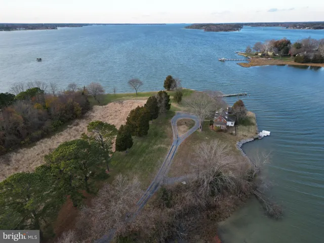 an aerial view of a house with outdoor space
